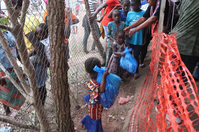 Child receiving some items